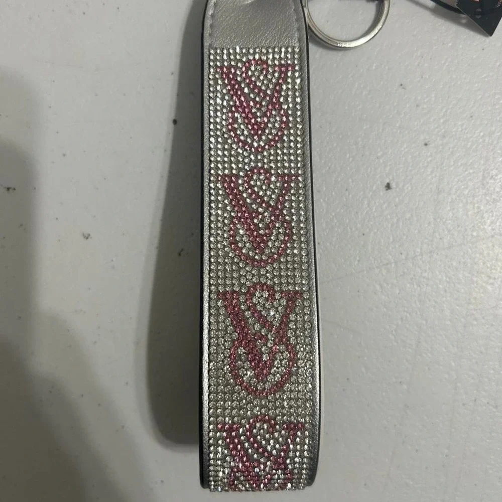 Victoria's Secret pink & silver rhinestone keychain with repeating V-shaped